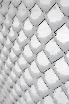 netting netting covered with snow as background. High quality photo