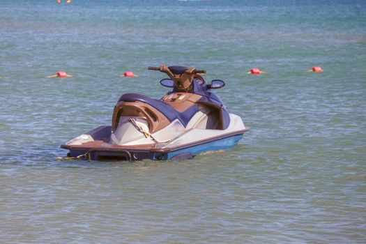 a jet ski stands on the water without people. High quality photo