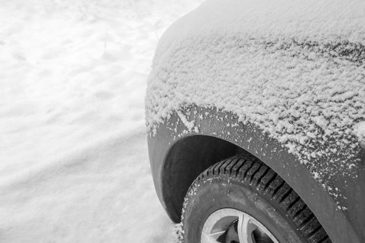 snow-covered car on the background of snow. High quality photo