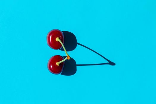 cherry berry with a hard shadow on a plain background. the view from the top. blank for the pattern. High quality photo