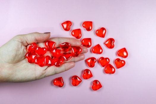 glass hearts on your hand Close up. High quality photo