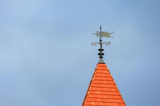 A tower that has a sign on the side of a building. High quality photo