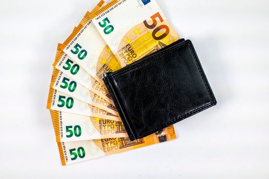 50 euro banknotes fanned with wallet on white background