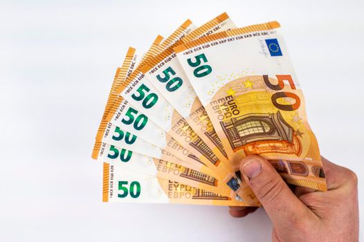 hand of man with 50 euro fan over white background