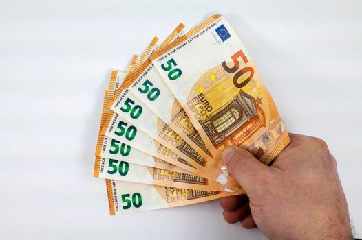 hand of man with 50 euro fan over white background