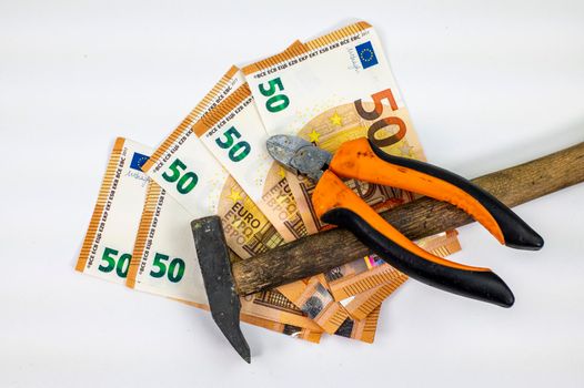 50 euro bills with work tools on white background