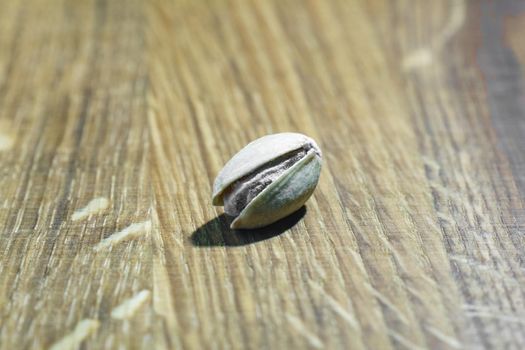 pistachio on a wooden background a macro. High quality photo
