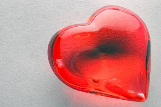 glass heart on a white background isolate macro