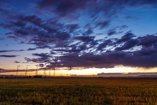 Dramatic sunset over a field in summer