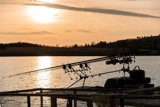 Fishing on the lake sunset in spring
