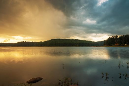 Lake sunrise / Beautiful sunrise view of Shiroka Polyana dam in Rhodopi Mountains, Bulgaria