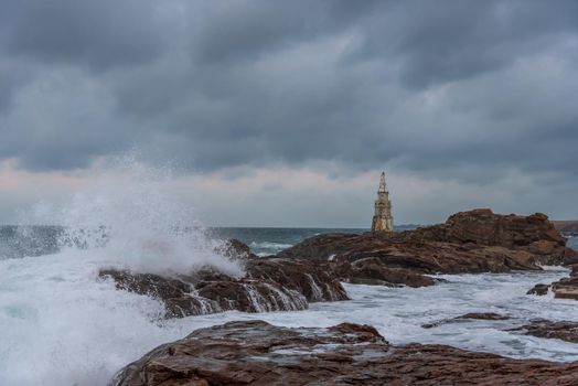 Stormy cloudy day. Dramatic sky and huge waves at the Lighthouse, Ahtopol, Bulgaria
