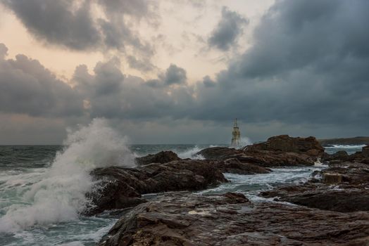 Stormy cloudy day. Dramatic sky and huge waves at the Lighthouse, Ahtopol, Bulgaria