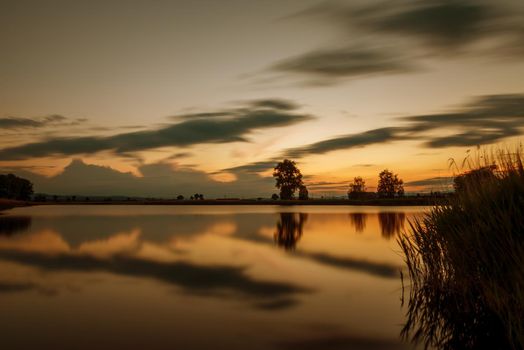Magnificent long exposure lake sunset in summer