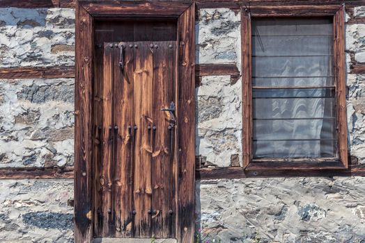 Old wooden door and a window 