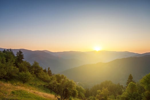 Panoramic view of colorful sunrise in mountains in summer