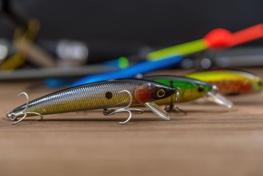 Fishing lures on a wooden background