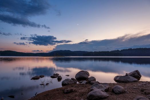 sunset over a mountain lake in the rodopi in Bulgaria