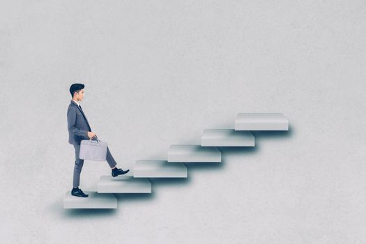 Businessman in suit walking up stair to achievement, man is leader climbing with aspiration for goal, inspiration and development for inspiration while progress go to winner, business concept.