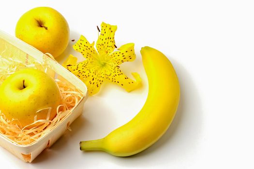 tiger Lily with banana and Apple on a white background close-up. isolate. High quality photo