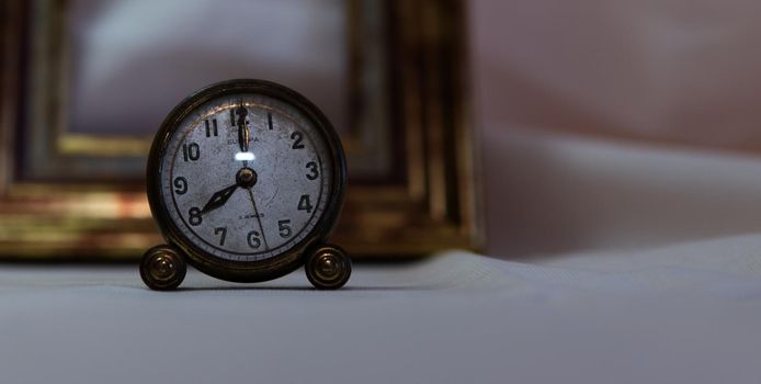 Vintage clock with white background and gold frame