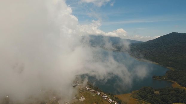 Aerial view of Lake Buyan,caldera lake at Bali. Beautiful lake with turquoise water in the mountains of the island of Bali. Landscape, lake among mountains, sky, clouds.