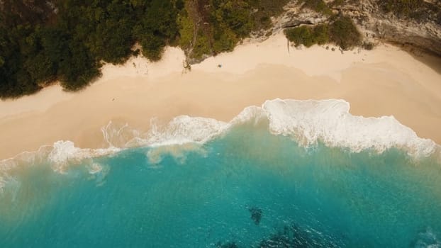 Tropical beach among rocky cliffs. Karang Dawa, Manta Bay or Kelingking Beach on Nusa Penida Island, Bali, Indonesia. Travel concept.