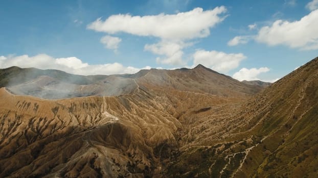 Crater with active volcano smoke in East Jawa, Indonesia. Aerial view of volcano crater Mount Gunung Bromo is an active volcano,Tengger Semeru National Park.