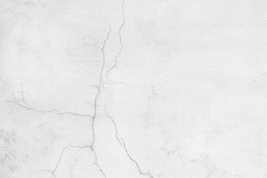 Peeling old wall with a crack and roughness close up.Texture or background