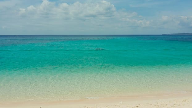 Tropical sandy beach with wave and turquoise water,copy space for text, aerial view. Ocean with waves and tropical beach. Summer and travel vacation concept