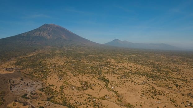 Agung, mountain, mountains covered with green forest, trees with sky and clouds. Slopes of the mountains are covered with forest in Asia. Bali,Indonesia. Travel concept.