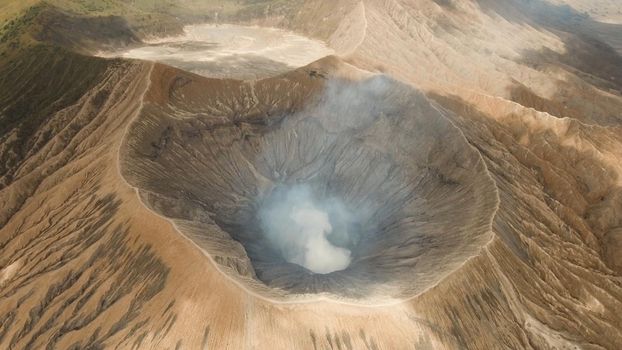 Crater with active volcano smoke in East Jawa, Indonesia. Aerial view of volcano crater Mount Gunung Bromo is an active volcano,Tengger Semeru National Park.