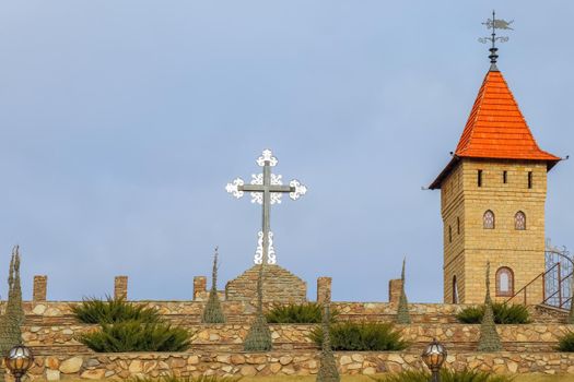 Church and cross against the blue sky. High quality photo