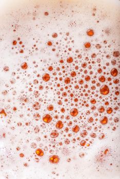 Light Beer with Bubbles and Foam Background. Beer Bubbles Texture Close Up.