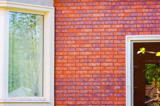 Clinker brick of brown color. Clinker thermal panels for finishing the facade of the house. Tiles for outdoor decoration