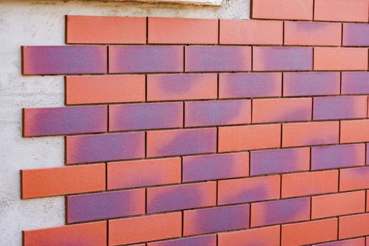 Clinker brick of brown color. Clinker thermal panels for finishing the facade of the house. Tiles for outdoor decoration