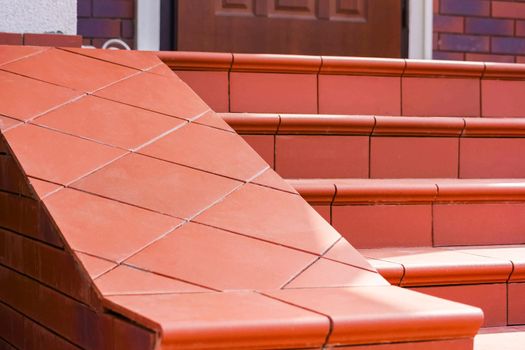 Steps made of brown clinker tiles . Cottage porch