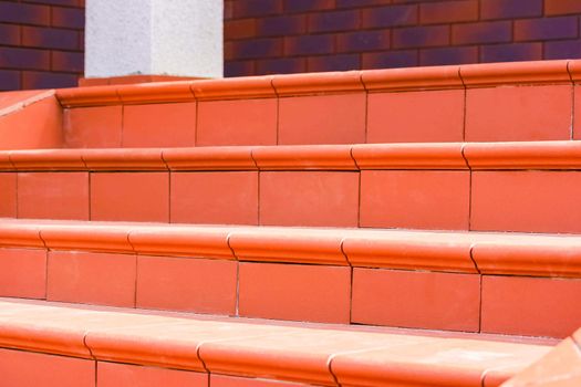 Steps made of brown clinker tiles . Cottage porch