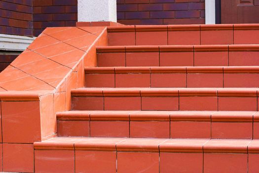 Steps made of brown clinker tiles . Cottage porch