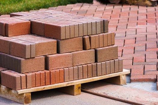 Brown clinker paving stones for laying paths in the garden. German brick