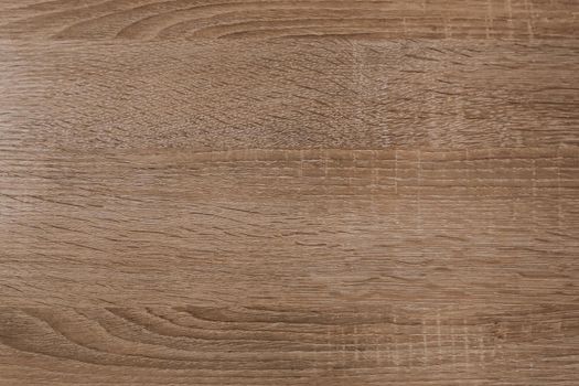 The background of the board is ash wood light yellow with a beautiful texture. Close-up of the cut.