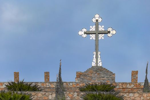 Church and cross against the blue sky. High quality photo