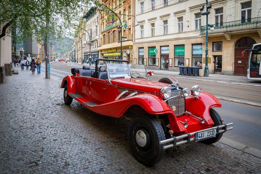 Czech Republic 14 april 2018 Vintage cars for tourist excursions. Red convertible on the road.