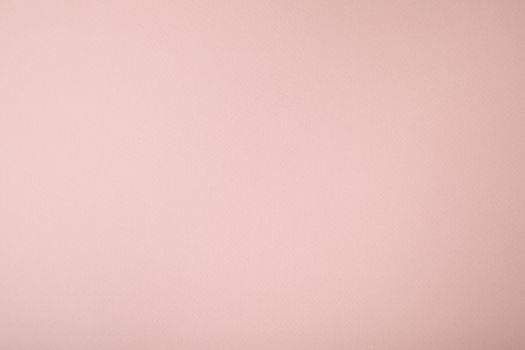 Pink background with paper texture, horizontal, blank space.