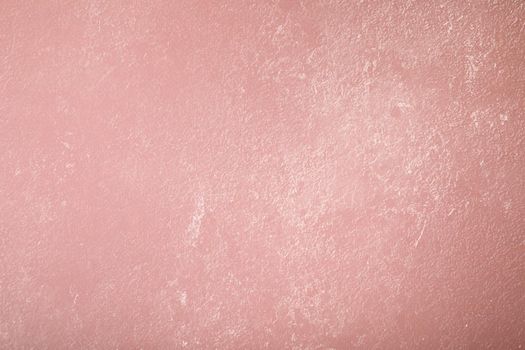 Pink background with paper texture, horizontal, blank space.