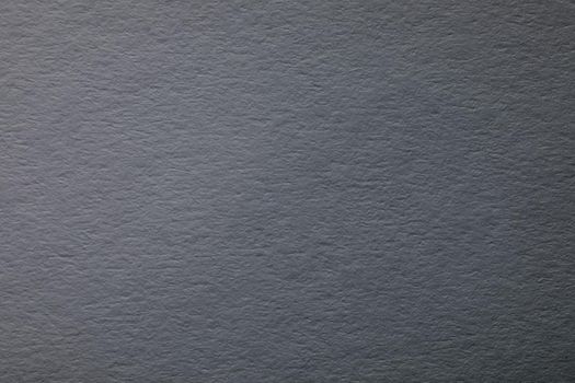 Gray background with paper texture, horizontal, blank space.