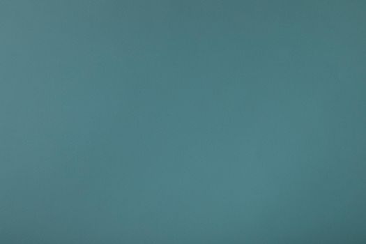 Blue background with paper texture, horizontal, blank space.