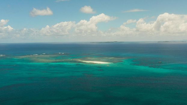 Tropical islands in turquoise lagoon and coral reef water, aerial view. Summer and travel vacation concept. Siargao,Philippines.