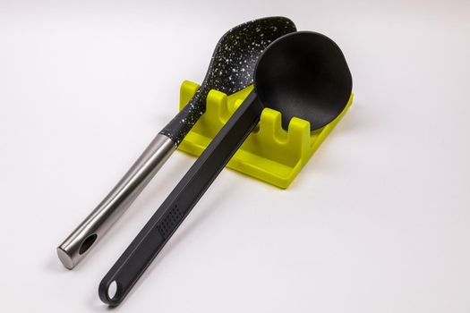 Stand, tray for large spoons, ladles, stirrers. Modern fittings in the kitchen. Convenient to prepare food.