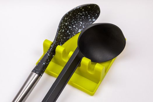 Stand, tray for large spoons, ladles, stirrers. Modern fittings in the kitchen. Convenient to prepare food.